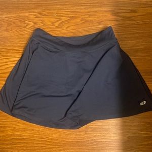 Sketchers skort size large, has shorts and pockets underneath